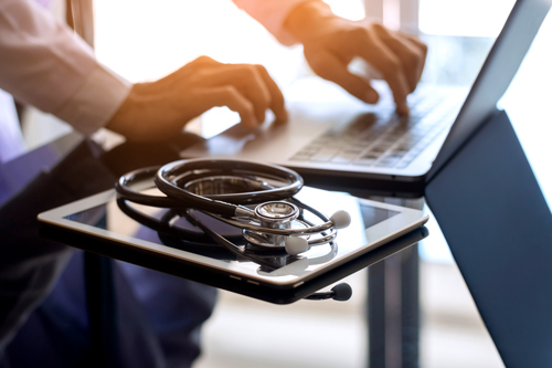 doctor-on-laptop-with-stethoscope River City Bank’s Riley Gardner with Randy Paragary