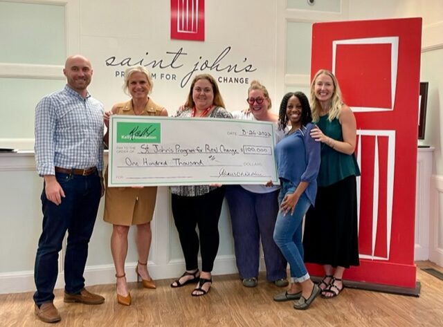 IMG_8641-e1662648665600 Members from River City Bank and the Kelly Foundation present a check to the Saint John’s leadership team
